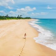 Woman walking on a beach in Sri Lanka