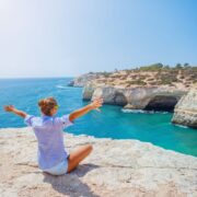 Female tourist overlooking coast in the Algarve